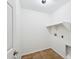 This functional laundry room has tile flooring and built in shelving for added convenience at 11158 N 162Nd Dr, Surprise, AZ 85379