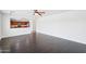 Open living space connects to kitchen featuring stainless steel appliances and wood cabinets at 11158 N 162Nd Dr, Surprise, AZ 85379