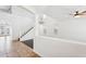 Bright, open-concept living room with high ceilings, staircase, large windows, and tile flooring at 11158 N 162Nd Dr, Surprise, AZ 85379