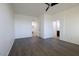 Spacious bedroom with laminate floors, ceiling fan, and ample natural light at 120 W Milada Dr, Phoenix, AZ 85041