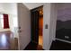 A hallway with an open elevator featuring carpet and wood walls, and a mountain mural nearby at 120 W Milada Dr, Phoenix, AZ 85041