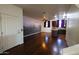 Open concept living room and kitchen area with wood floors and colorful accents at 120 W Milada Dr, Phoenix, AZ 85041