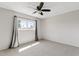 Comfortable bedroom with carpet, a ceiling fan, curtains and a window for natural light at 12201 N 22Nd Pl, Phoenix, AZ 85022