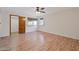 Spacious bedroom featuring wood floors, a ceiling fan, and natural light from the windows at 13019 N 23Rd Pl, Phoenix, AZ 85022