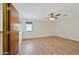 Bright bedroom boasts wood floors, a ceiling fan, and a window at 13019 N 23Rd Pl, Phoenix, AZ 85022