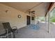 Inviting covered patio with tile flooring, ceiling fan, and views of the lush backyard at 13019 N 23Rd Pl, Phoenix, AZ 85022