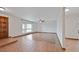Bright living room with tile flooring, a large window and classic door at 13019 N 23Rd Pl, Phoenix, AZ 85022
