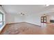 Open-concept living room features tile floors, a ceiling fan, and access to the fireplace at 13019 N 23Rd Pl, Phoenix, AZ 85022