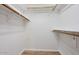 Functional walk-in closet with wood-look flooring, white walls, and shelving providing ample storage and organization at 13019 N 23Rd Pl, Phoenix, AZ 85022