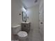 This half-bathroom features a modern vanity, gray paint, and sleek fixtures at 14860 S Capistrano Rd, Arizona City, AZ 85123