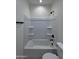 A bathroom featuring a shower and tub combo, and tile floors at 14860 S Capistrano Rd, Arizona City, AZ 85123
