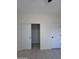 Bedroom with a sliding closet door that is opened to show the closet interior at 14860 S Capistrano Rd, Arizona City, AZ 85123