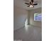 Bedroom featuring tile floors, window, and ceiling fan with lights at 14860 S Capistrano Rd, Arizona City, AZ 85123