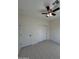 An interior view of bedroom with tiled floor, fan with lights, and closet at 14860 S Capistrano Rd, Arizona City, AZ 85123