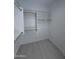 Walk-in closet with built-in shelves and a clothes rod at 14860 S Capistrano Rd, Arizona City, AZ 85123