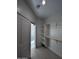 Open walk-in closet with built-in shelving and a clothes rod at 14860 S Capistrano Rd, Arizona City, AZ 85123