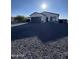 Attractive one-story house with a spacious driveway and a two-car garage on a sunny day at 14860 S Capistrano Rd, Arizona City, AZ 85123