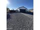 Inviting one-story home boasting an attached two-car garage and an extended driveway at 14860 S Capistrano Rd, Arizona City, AZ 85123