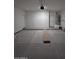 An empty new two-car garage provides a blank canvas for storage and projects at 14860 S Capistrano Rd, Arizona City, AZ 85123