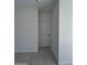 Hallway with neutral walls and tile flooring at 14860 S Capistrano Rd, Arizona City, AZ 85123