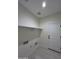 This spacious laundry room has lots of open space and a shelf at 14860 S Capistrano Rd, Arizona City, AZ 85123