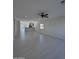 Spacious living area with tile flooring and an open layout to the kitchen at 14860 S Capistrano Rd, Arizona City, AZ 85123