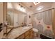 Bathroom featuring granite countertops, a decorative mirror, and a shower with an abstract curtain at 1500 N Markdale -- # 68, Mesa, AZ 85201