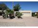 Charming home featuring a two-car garage, desert landscaping, and a gated front entrance at 1500 N Markdale -- # 68, Mesa, AZ 85201