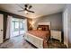 Comfortable main bedroom with sliding glass doors to the outdoor patio and a ensuite bathroom at 1500 N Markdale -- # 68, Mesa, AZ 85201