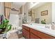Traditional bathroom showcases a double vanity, a framed mirror, and a shower-tub combo at 157 W Leatherwood Ave, San Tan Valley, AZ 85140