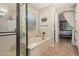 Bathroom showcasing a shower, tub, and plenty of natural light at 157 W Leatherwood Ave, San Tan Valley, AZ 85140