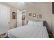 Comfortable bedroom offers a queen size bed, fan and view through to the next room at 157 W Leatherwood Ave, San Tan Valley, AZ 85140