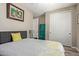 Neutral bedroom features a queen bed with floral bedding, painted walls, and a closet at 157 W Leatherwood Ave, San Tan Valley, AZ 85140