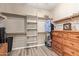 Spacious walk-in closet offering ample storage space with shelving and drawers at 157 W Leatherwood Ave, San Tan Valley, AZ 85140