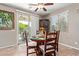 Bright dining area with sliding glass doors, stylish furnishings and view to backyard at 157 W Leatherwood Ave, San Tan Valley, AZ 85140