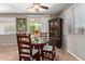 Bright dining area with sliding glass doors, stylish furnishings and view to backyard at 157 W Leatherwood Ave, San Tan Valley, AZ 85140