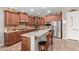Open kitchen with granite countertops, stainless steel appliances, and custom cabinetry at 157 W Leatherwood Ave, San Tan Valley, AZ 85140
