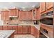 Gourmet kitchen with granite countertops, stainless steel appliances, and custom cabinetry at 157 W Leatherwood Ave, San Tan Valley, AZ 85140