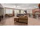 Spacious living room with comfortable seating, ceiling fans, and tile flooring at 157 W Leatherwood Ave, San Tan Valley, AZ 85140