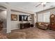 Comfortable living room featuring tile flooring, a ceiling fan, and warm neutral tones at 157 W Leatherwood Ave, San Tan Valley, AZ 85140