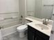 Bathroom featuring a shower over the tub, a toilet, and a single sink with vanity at 15801 W Meade Ln, Goodyear, AZ 85338