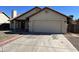 Charming single-story home with a two-car garage, manicured lawn, and inviting curb appeal at 15801 W Meade Ln, Goodyear, AZ 85338