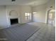 Spacious living room featuring a fireplace and tile flooring at 15801 W Meade Ln, Goodyear, AZ 85338