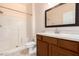 Bathroom with updated vanity, framed mirror, and shower with white tiling at 16450 E Avenue Of The Fountain Ave # 11, Fountain Hills, AZ 85268