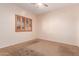 Spare bedroom featuring a neutral color palette and window with wood blinds at 16450 E Avenue Of The Fountain Ave # 11, Fountain Hills, AZ 85268