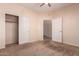 Bedroom with closet and ceiling fan, offering comfort and functionality at 16450 E Avenue Of The Fountain Ave # 11, Fountain Hills, AZ 85268