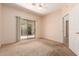 Bright bedroom with sliding glass door and view to outdoor greenery at 16450 E Avenue Of The Fountain Ave # 11, Fountain Hills, AZ 85268