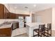 Well-equipped kitchen featuring an island with seating and a full suite of appliances at 16450 E Avenue Of The Fountain Ave # 11, Fountain Hills, AZ 85268