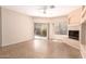 Open living space featuring fireplace, tiled floor, and sliding doors to the outdoor space at 16450 E Avenue Of The Fountain Ave # 11, Fountain Hills, AZ 85268