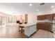 Open-concept living space featuring fireplace, kitchen with island and stainless steel appliances at 16450 E Avenue Of The Fountain Ave # 11, Fountain Hills, AZ 85268